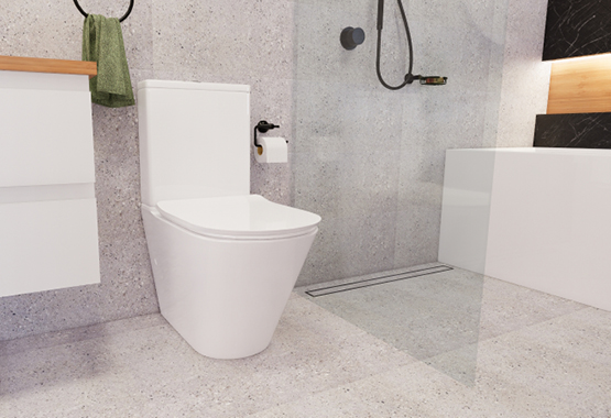 Toilet, grey tiles, glass showerscreen and black tapware